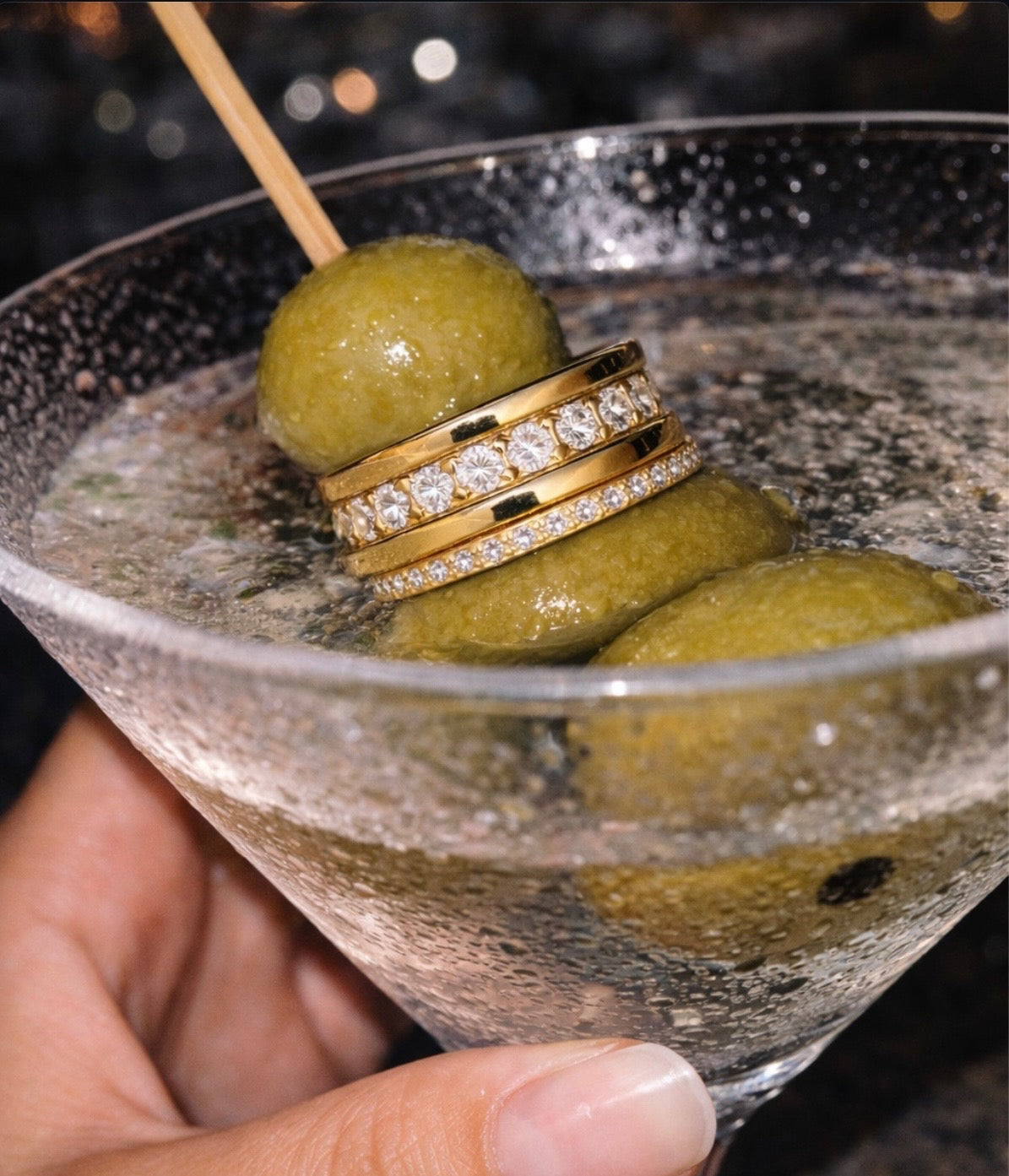 Gold diamond ring styled with a martini glass — women's jewelry at House of CAYA